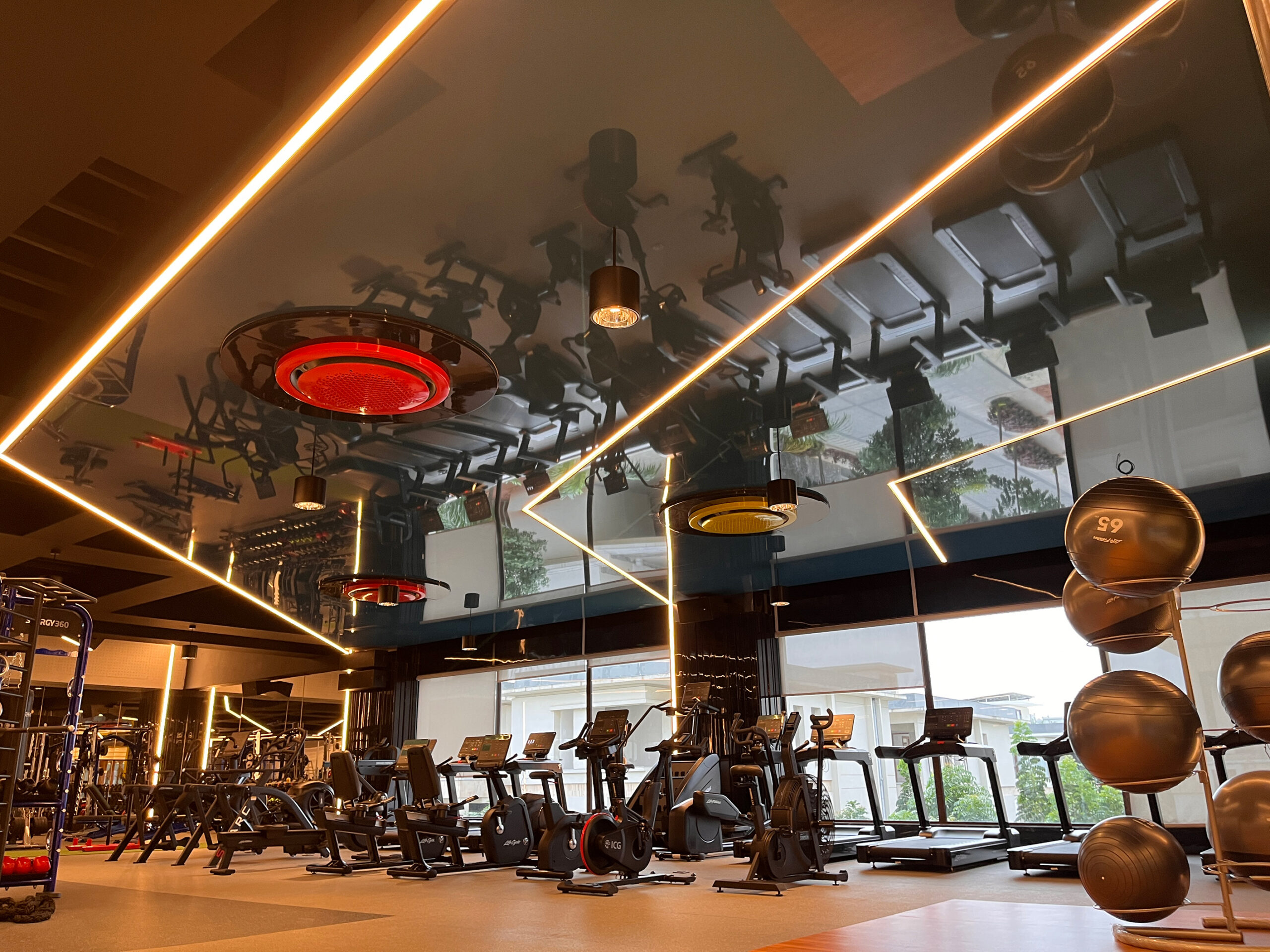 A gymnasium in Hyderabad with Newmat Acoustic Lacquered Stretch Ceilings.